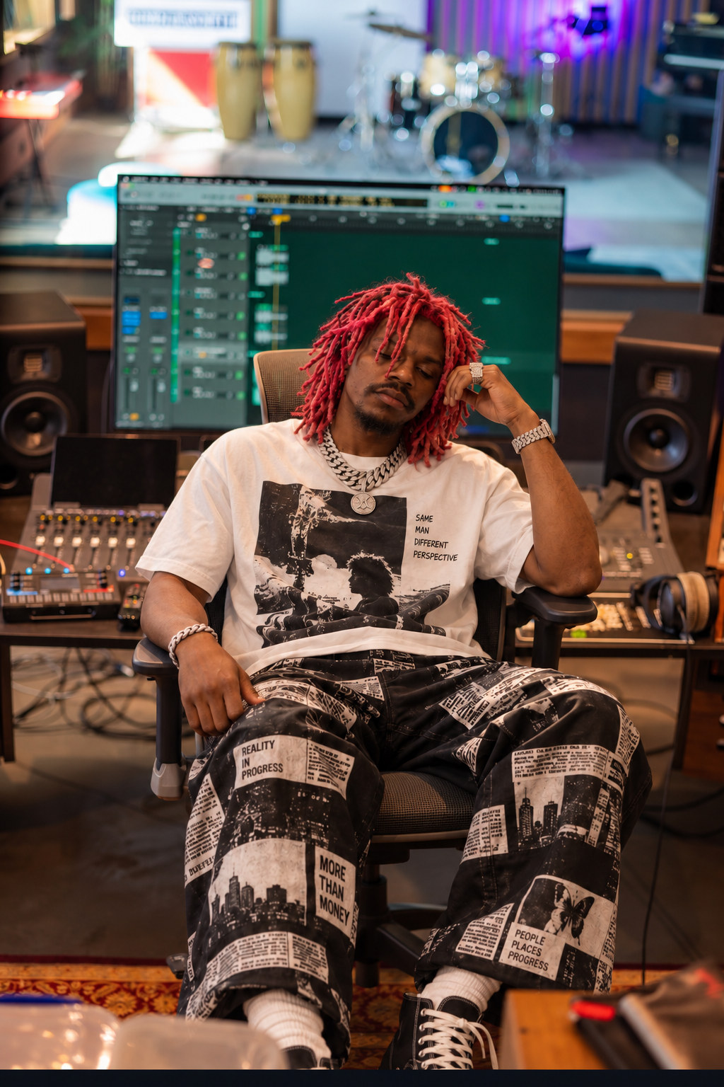 Prince Desire seated at the mixing desk in the Afri Kingdom studio.