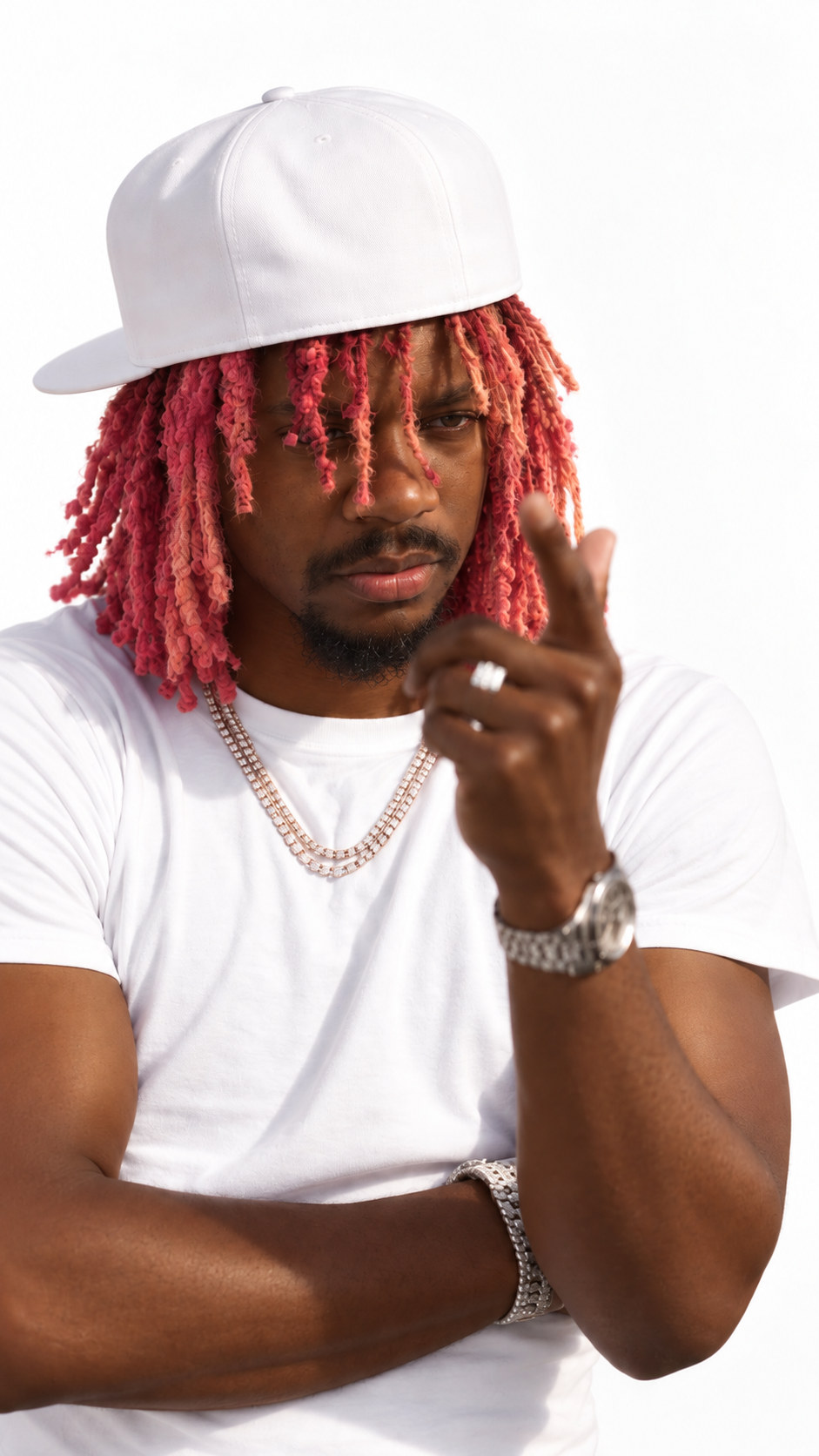 Prince Desire in a white cap and white tee with red locs.